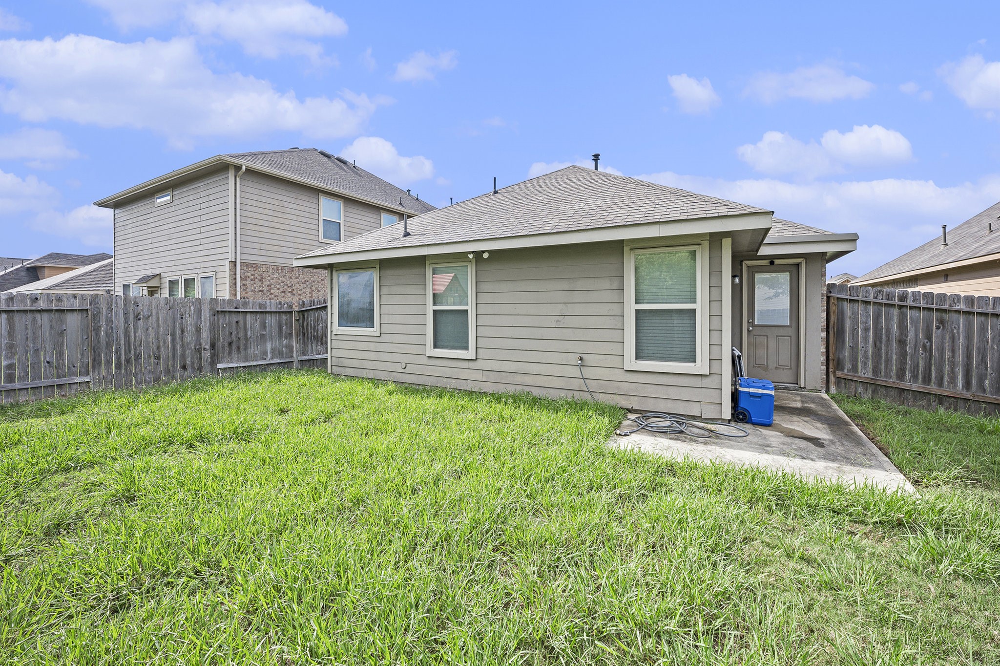 20719 Winghaven Drive Katy, TX 77449 - Photo 18 of 22 a view of a house with a yard and wooden fence