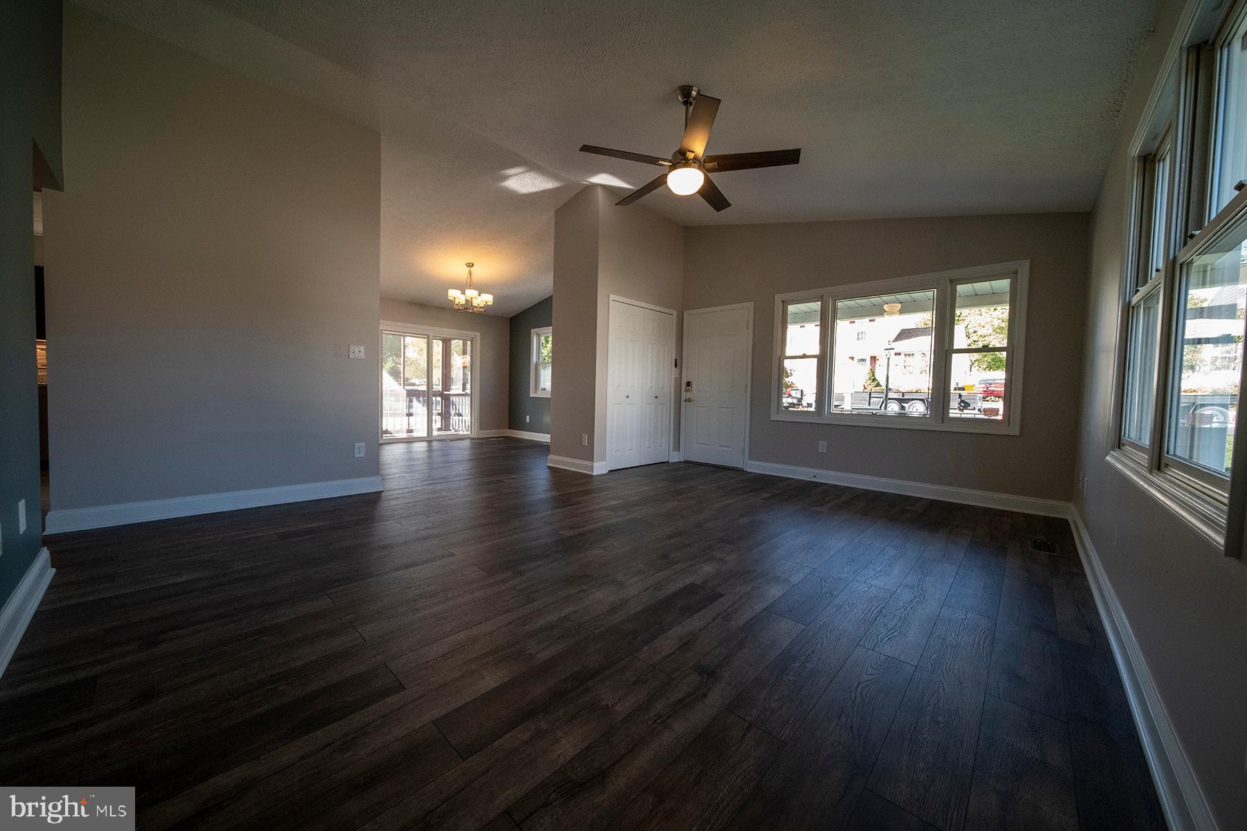 345 Edgewood Road Linthicum Heights, MD 21090 - Photo 13 of 63 a view of an empty room with wooden floor and a window