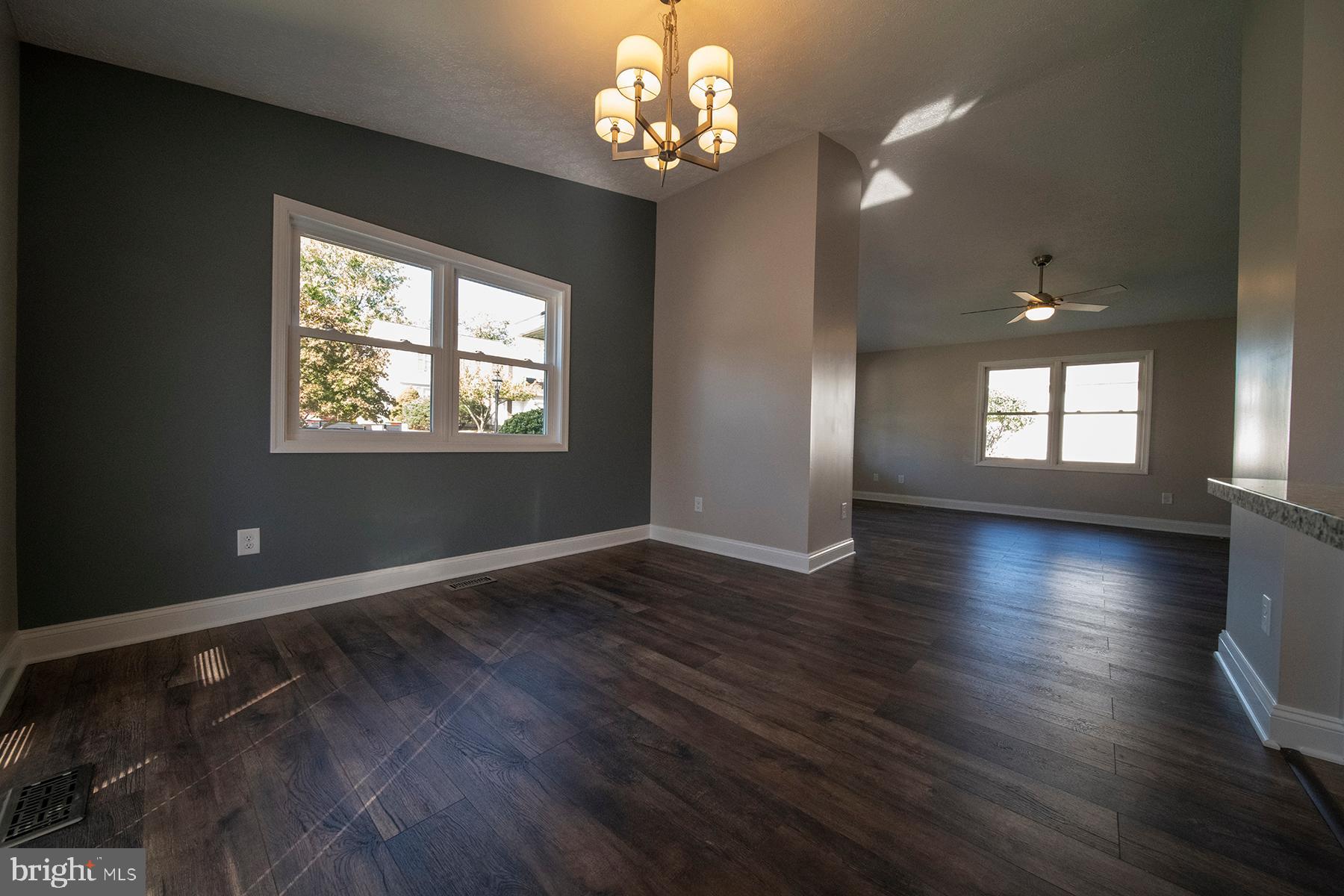 345 Edgewood Road Linthicum Heights, MD 21090 - Photo 17 of 63 a view of an empty room with wooden floor and a window