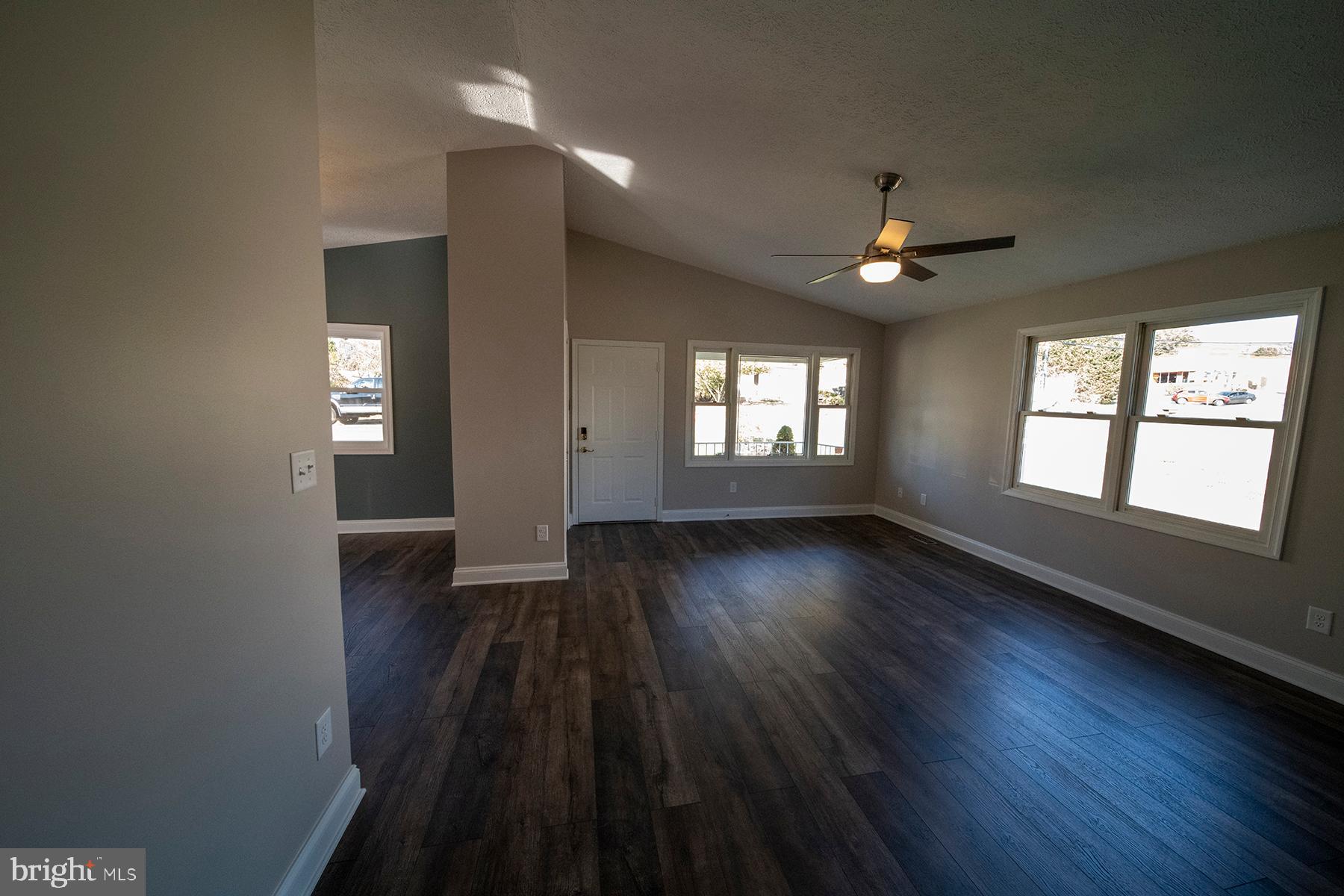 345 Edgewood Road Linthicum Heights, MD 21090 - Photo 18 of 63 an empty room with wooden floor and windows