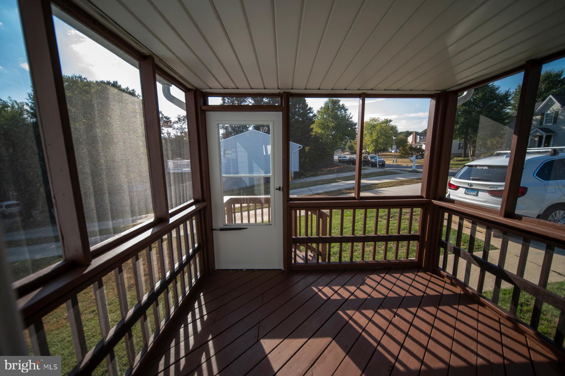 345 Edgewood Road Linthicum Heights, MD 21090 - Photo 24 of 63 a view of a porch with wooden floor and outdoor seating