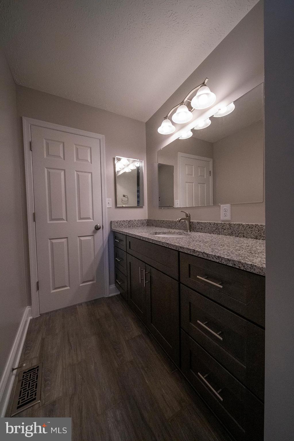 345 Edgewood Road Linthicum Heights, MD 21090 - Photo 29 of 63 a bathroom with a sink and a mirror