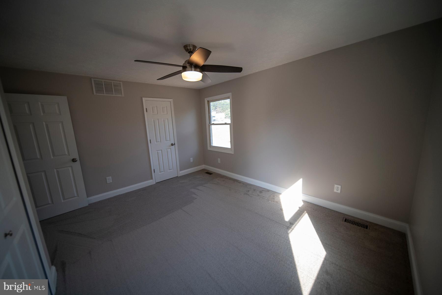 345 Edgewood Road Linthicum Heights, MD 21090 - Photo 32 of 63 wooden floor in an empty room with a window