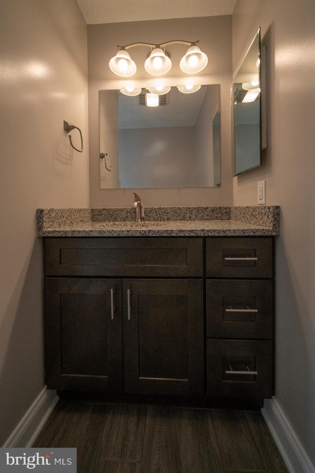345 Edgewood Road Linthicum Heights, MD 21090 - Photo 39 of 63 a bathroom with a sink and a mirror
