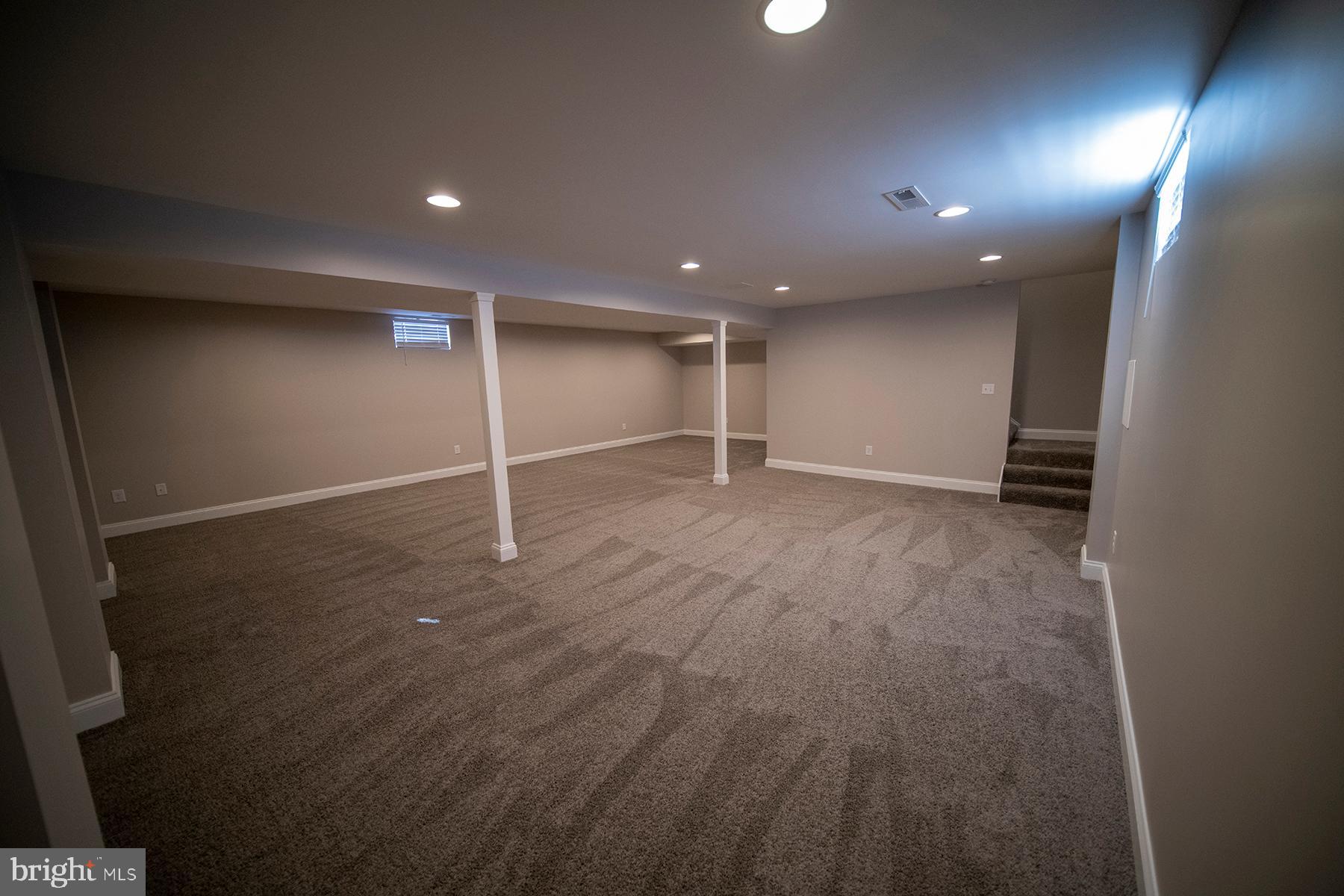 345 Edgewood Road Linthicum Heights, MD 21090 - Photo 48 of 63 an empty room with wooden floor and windows