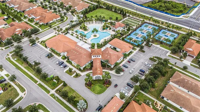 an aerial view of a house with a swimming pool