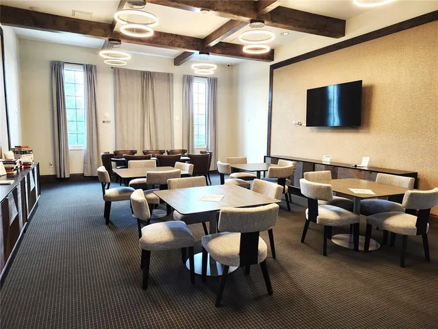 a view of a porch with furniture and a potted plant