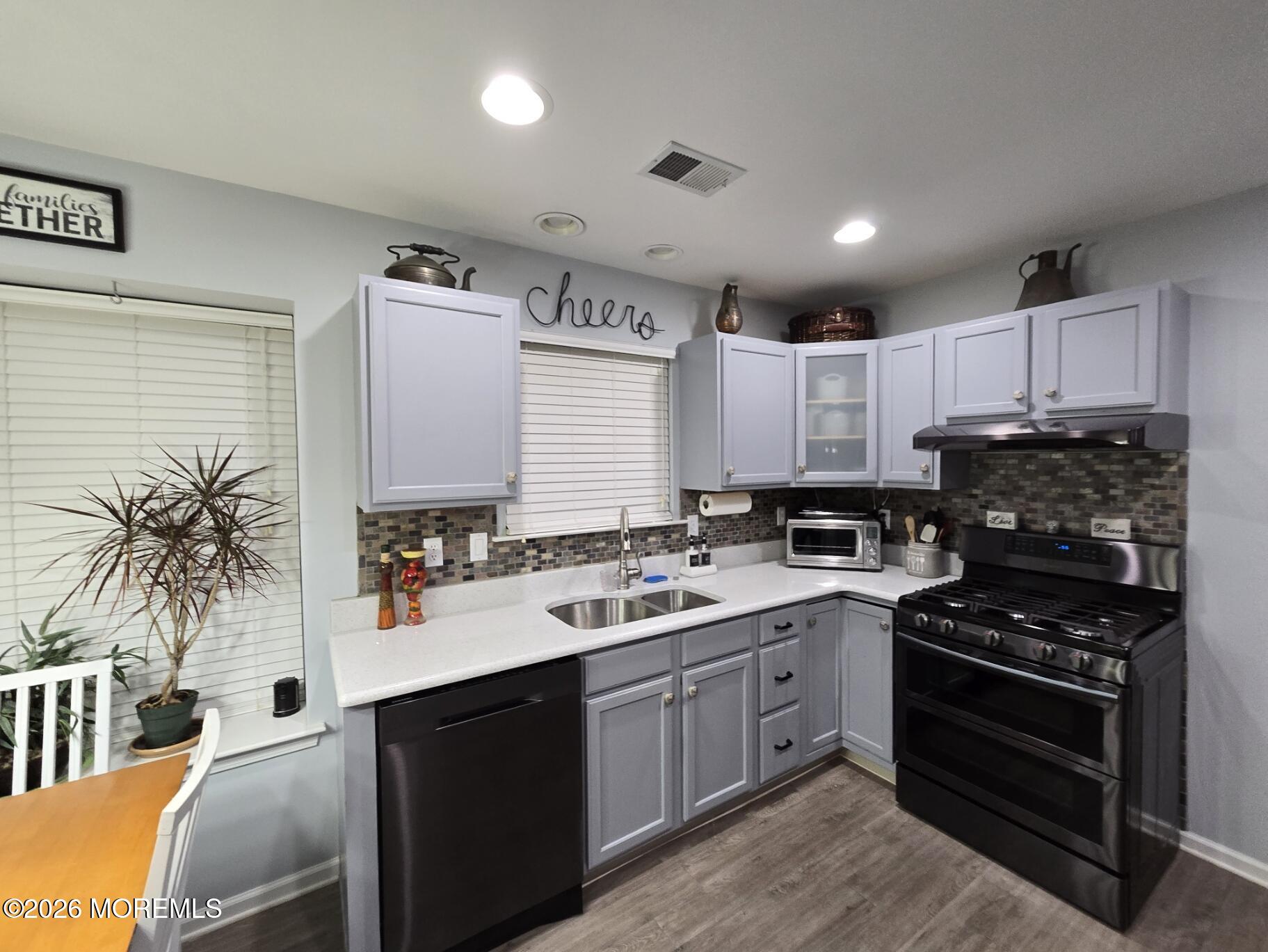 3276 Springer Lane Toms River, NJ 08755 - Photo 8 of 29 a kitchen with a sink stove and cabinets