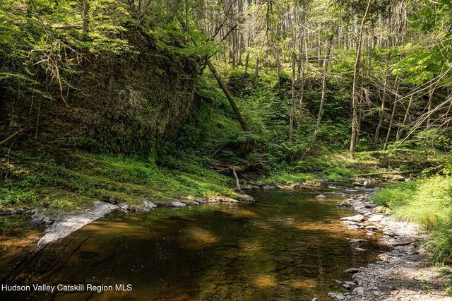 a view of a lake with a yard