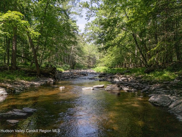 a view of houses with a yard and mountain view