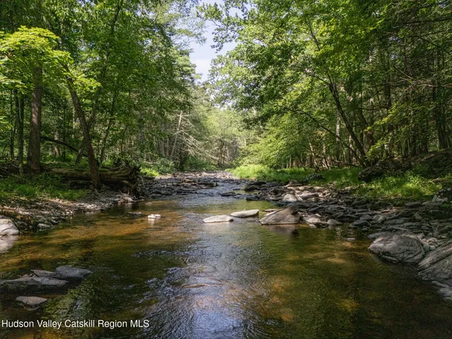 a view of houses with a yard and mountain view