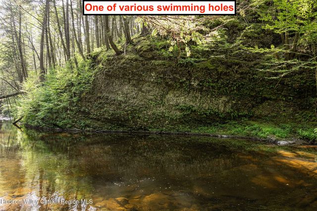 a backyard of a house with a yard with outdoor seating