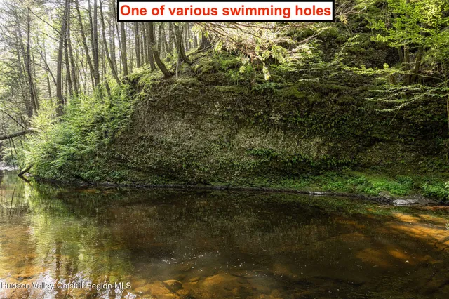 a backyard of a house with a yard with outdoor seating