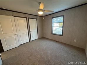 2898 Rte 9W New Windsor, NY 12553 - Photo 6 of 14 Unfurnished bedroom featuring carpet flooring, multiple closets, and a ceiling fan