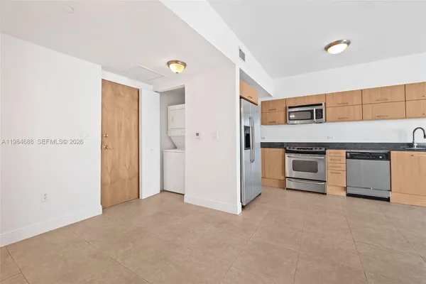 a view of a kitchen with a sink