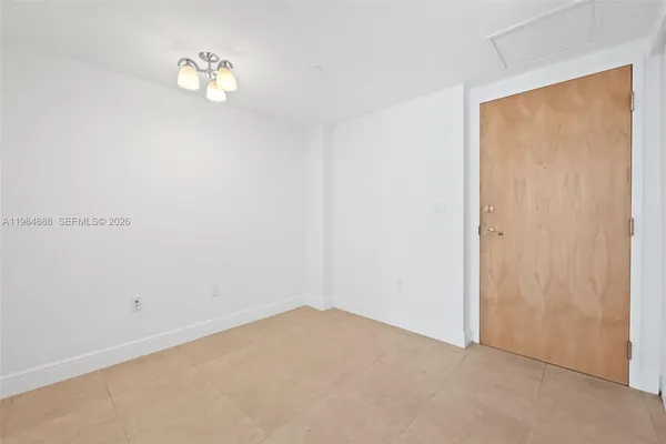 a view of a dinning room with floor to ceiling window and a glass door