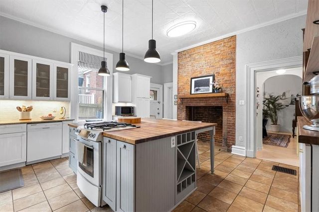 a kitchen that has a lot of cabinets in it