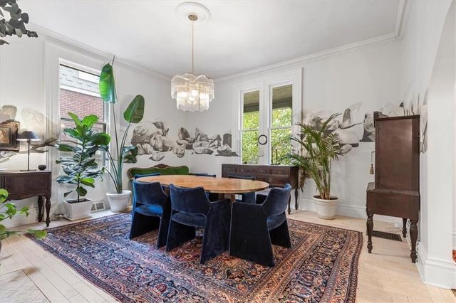 a view of a dining room with furniture window and wooden floor