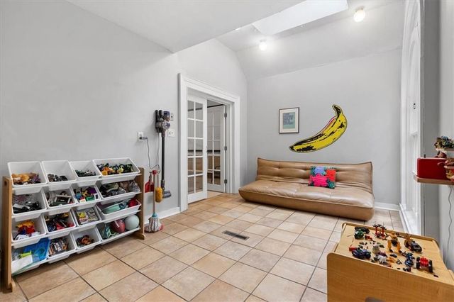 a view of staircase with white walls and a window