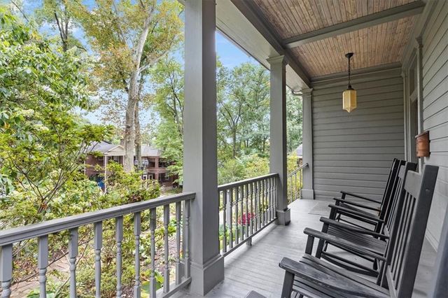 a view of a two chairs in the balcony