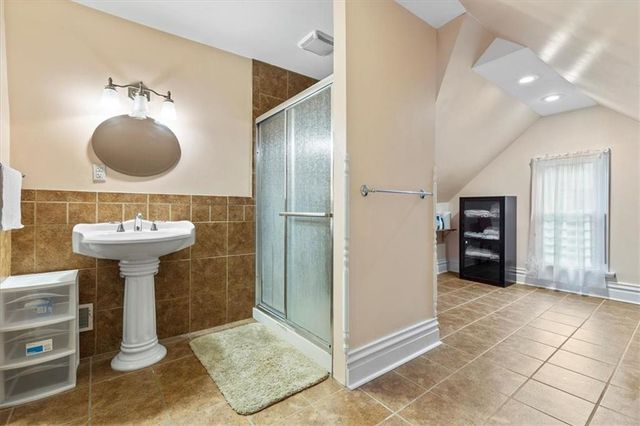 a view of a garden with wooden fence