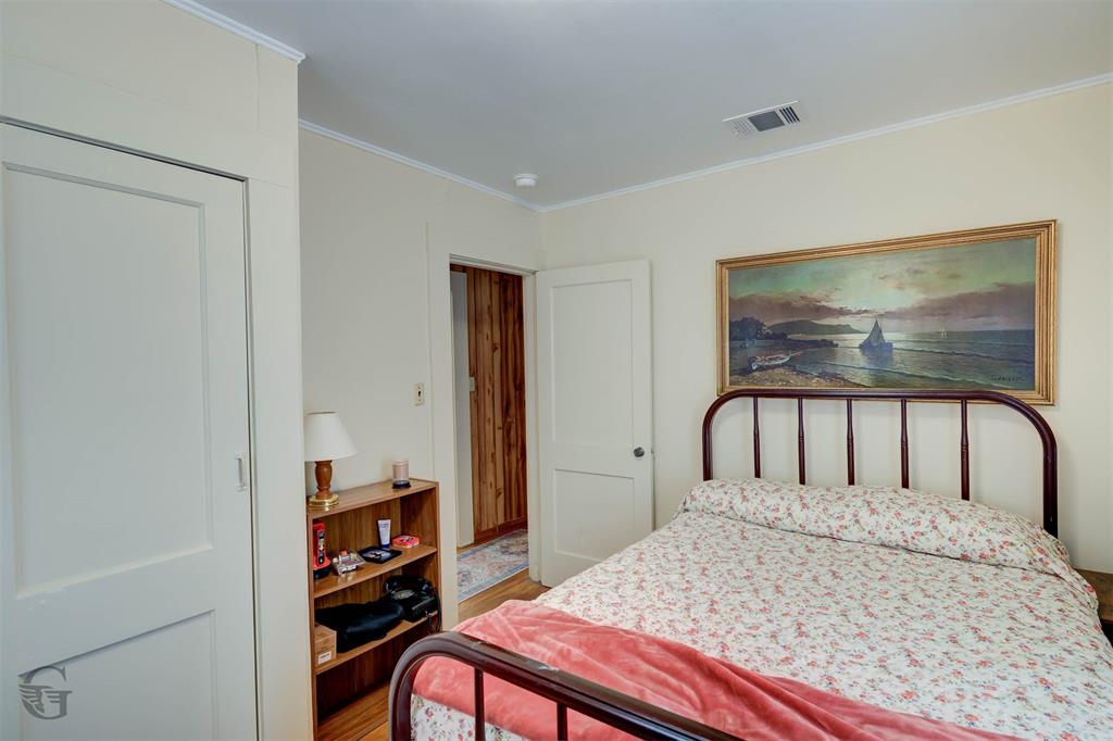 1366 United Gas Road Ringgold, LA 71068 - Photo 5 of 19 Bedroom with crown molding and wood finished floors