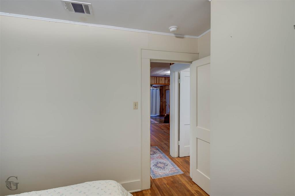 1366 United Gas Road Ringgold, LA 71068 - Photo 7 of 19 Bedroom featuring wood finished floors and ornamental molding