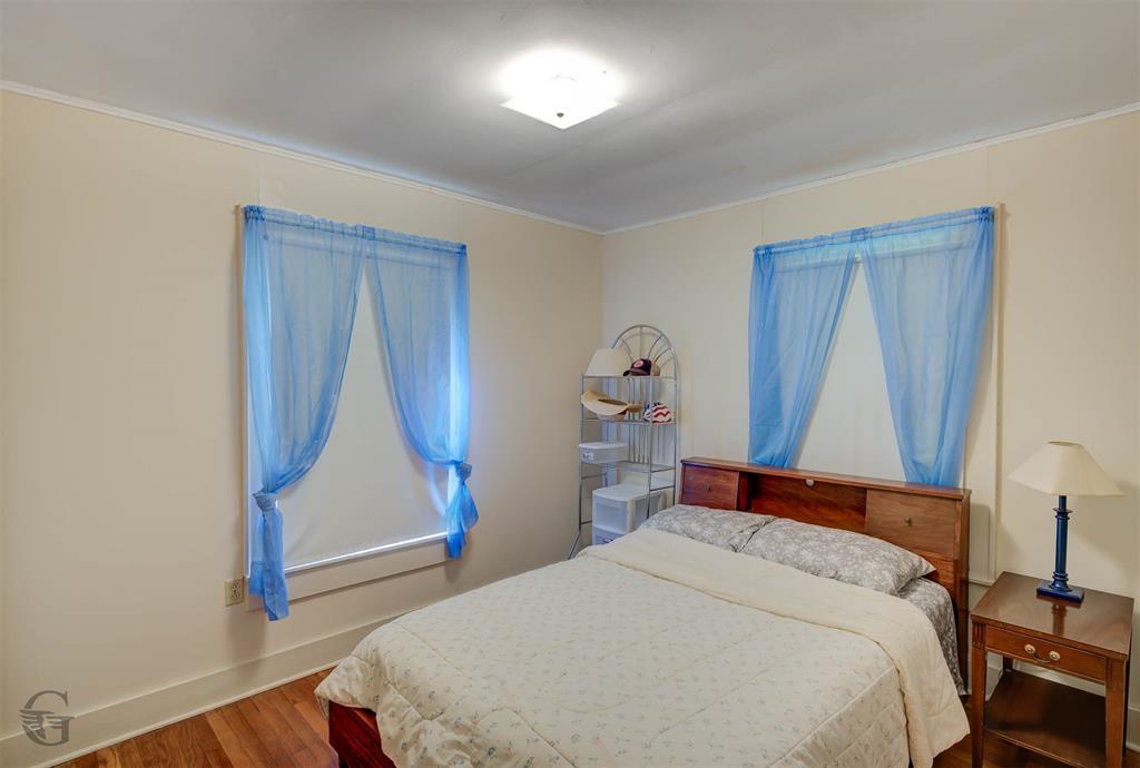 1366 United Gas Road Ringgold, LA 71068 - Photo 8 of 19 Bedroom featuring wood finished floors and crown molding