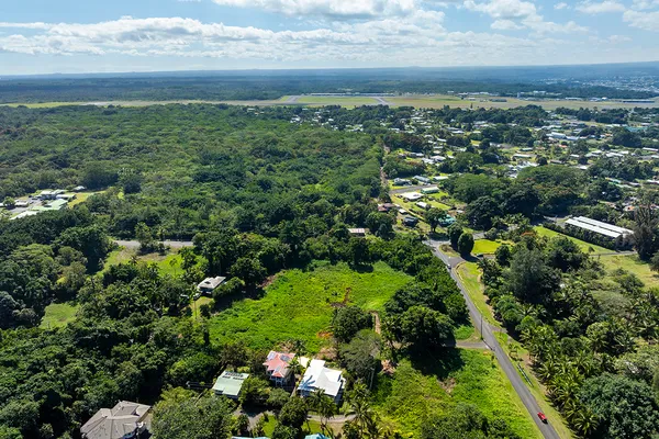 an aerial view of a house with a yard
