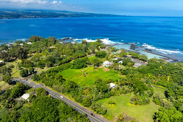 an aerial view of a houses with a yard