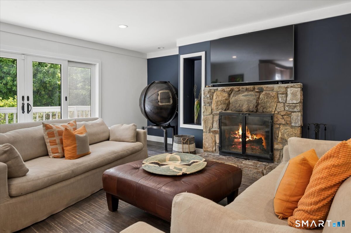 94 Vista Road Wilton, CT 06897 - Photo 20 of 38 a living room with furniture and a fireplace