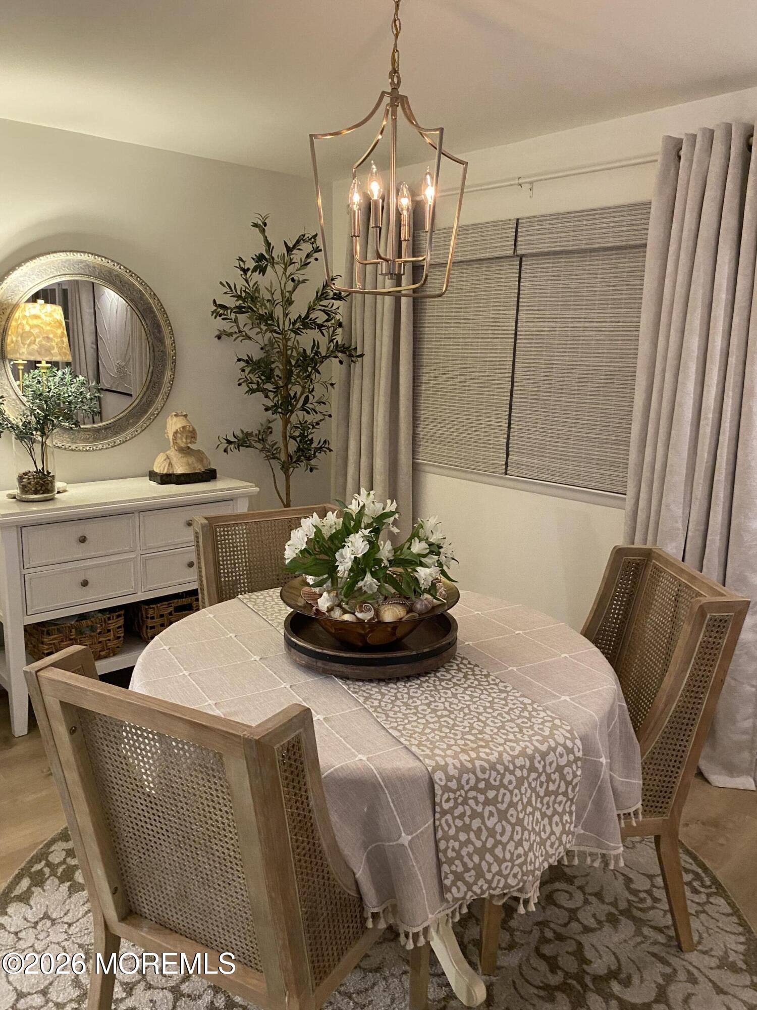 6 Patmore Road Brick, NJ 08724 - Photo 15 of 23 a living room with furniture and a chandelier