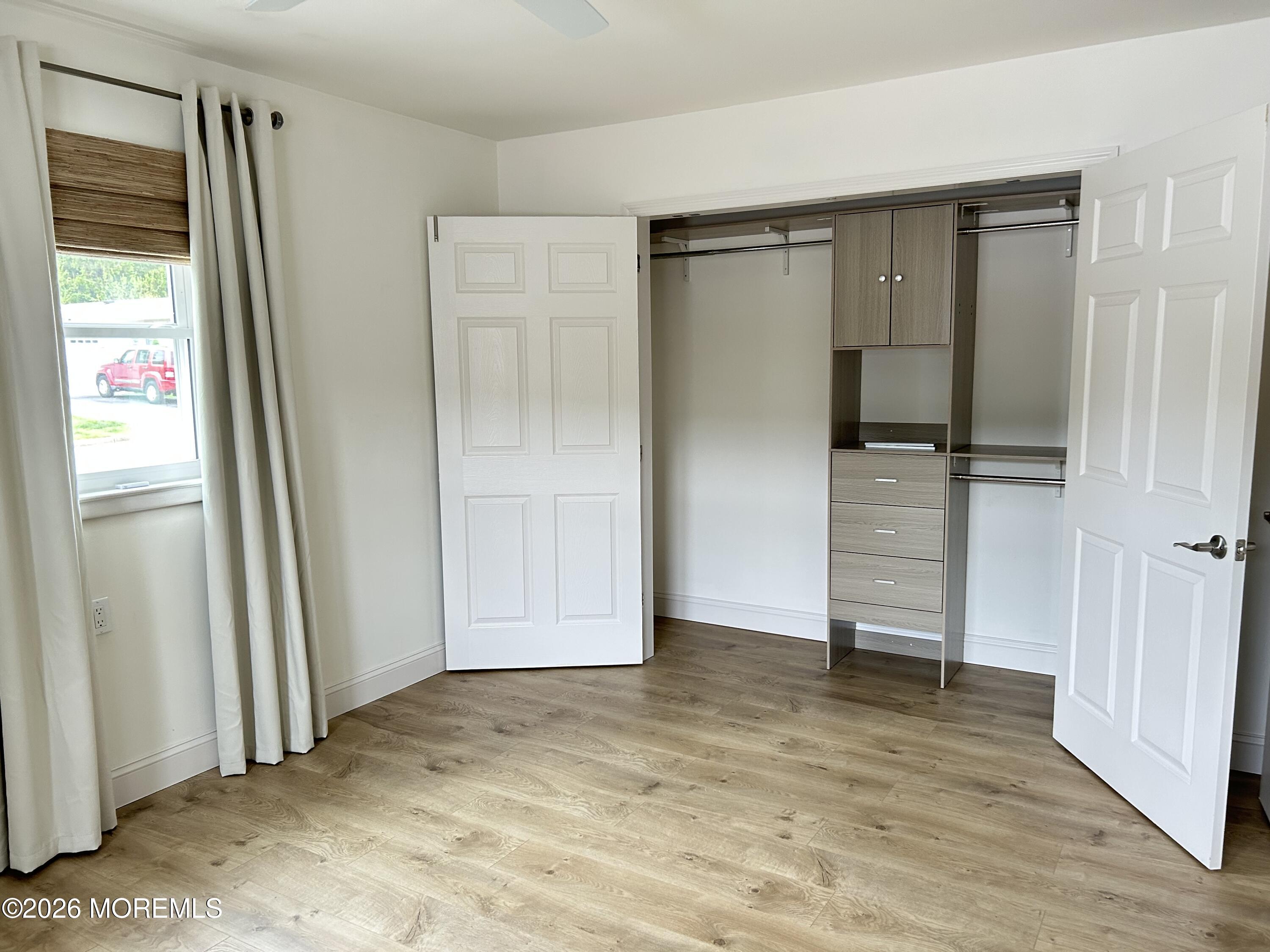 6 Patmore Road Brick, NJ 08724 - Photo 20 of 23 an empty room with closet and mirror
