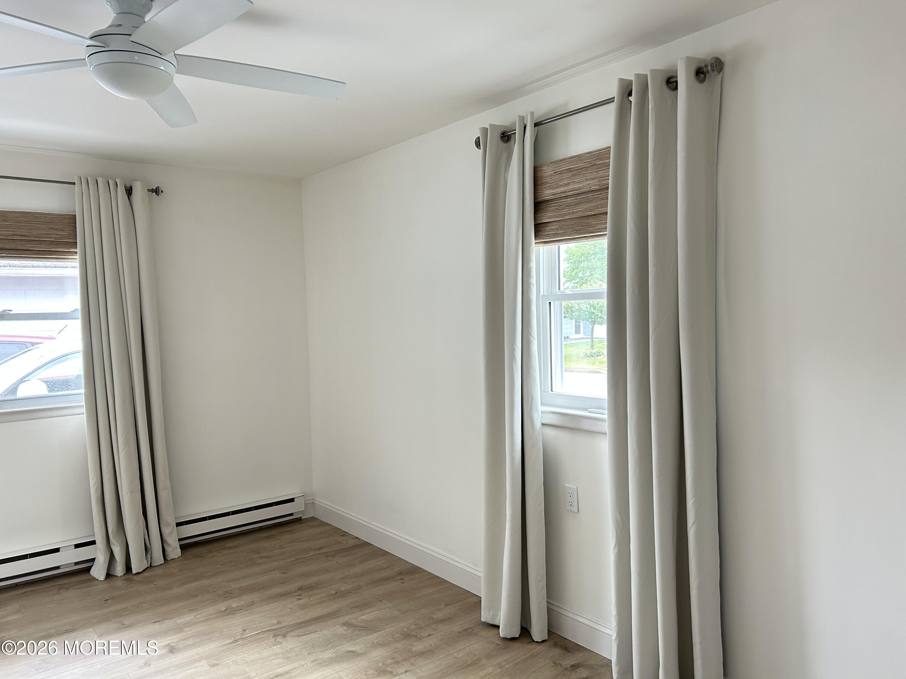 6 Patmore Road Brick, NJ 08724 - Photo 22 of 23 a view of an empty room with wooden floor and a window