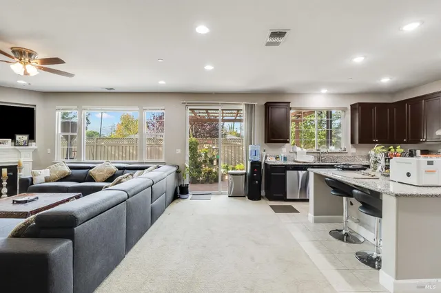 a front view of a house with sitting area