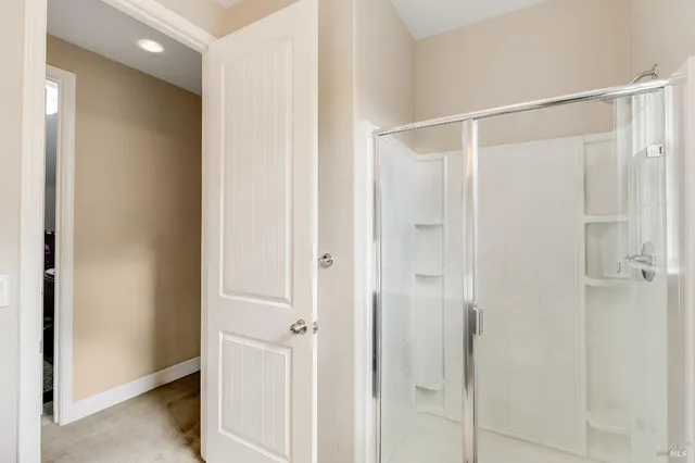 a living room with furniture and a ceiling fan