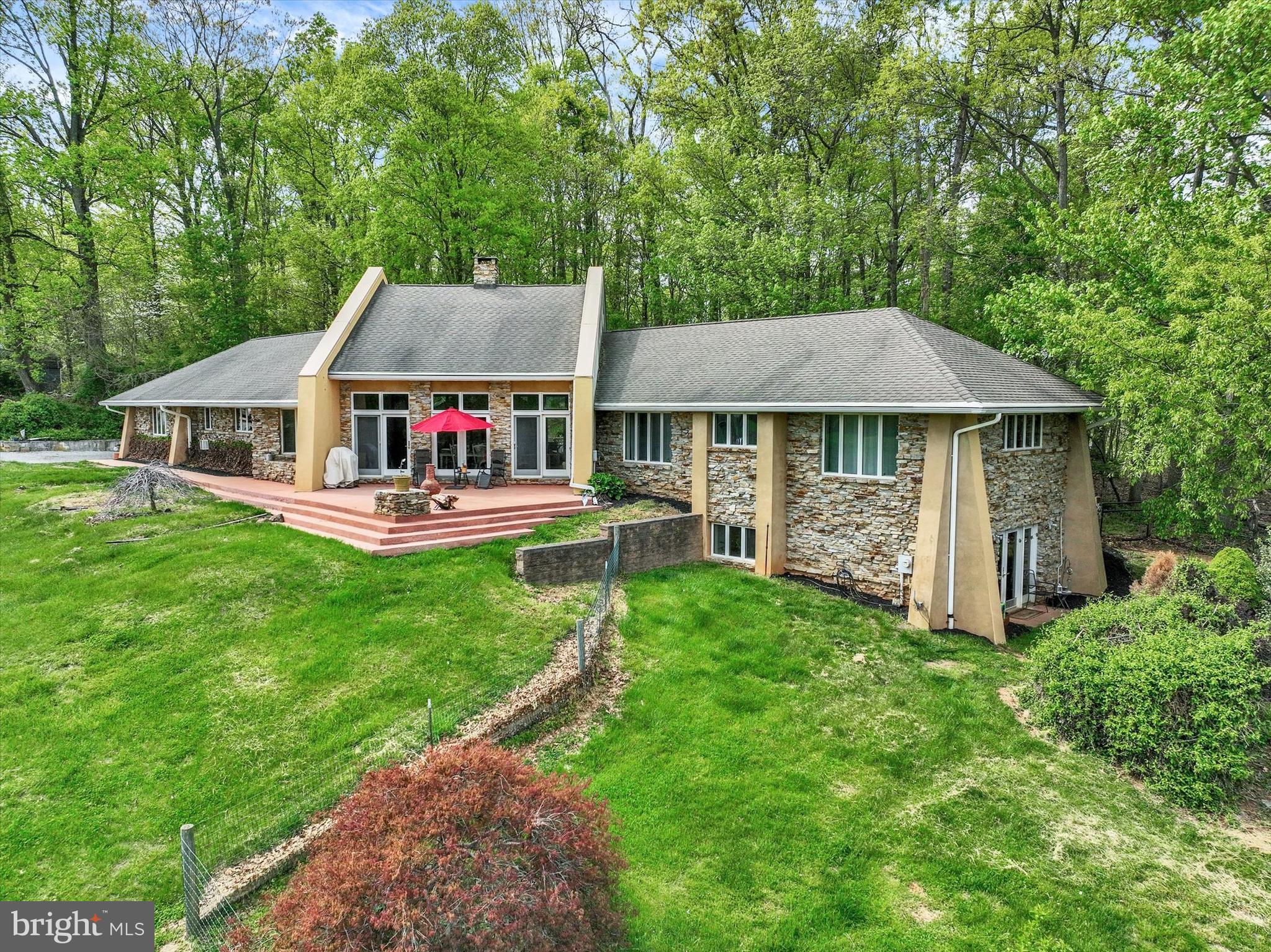 8272 Woodbine Road Airville, PA 17302 - Photo 1 of 53 a aerial view of a house with swimming pool and deck