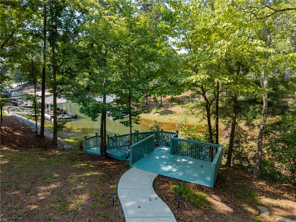 206 Petty Road Seneca, SC 29672 - Photo 38 of 47 A private boardwalk descends to a dual-level dock, inviting lakeside recreation.