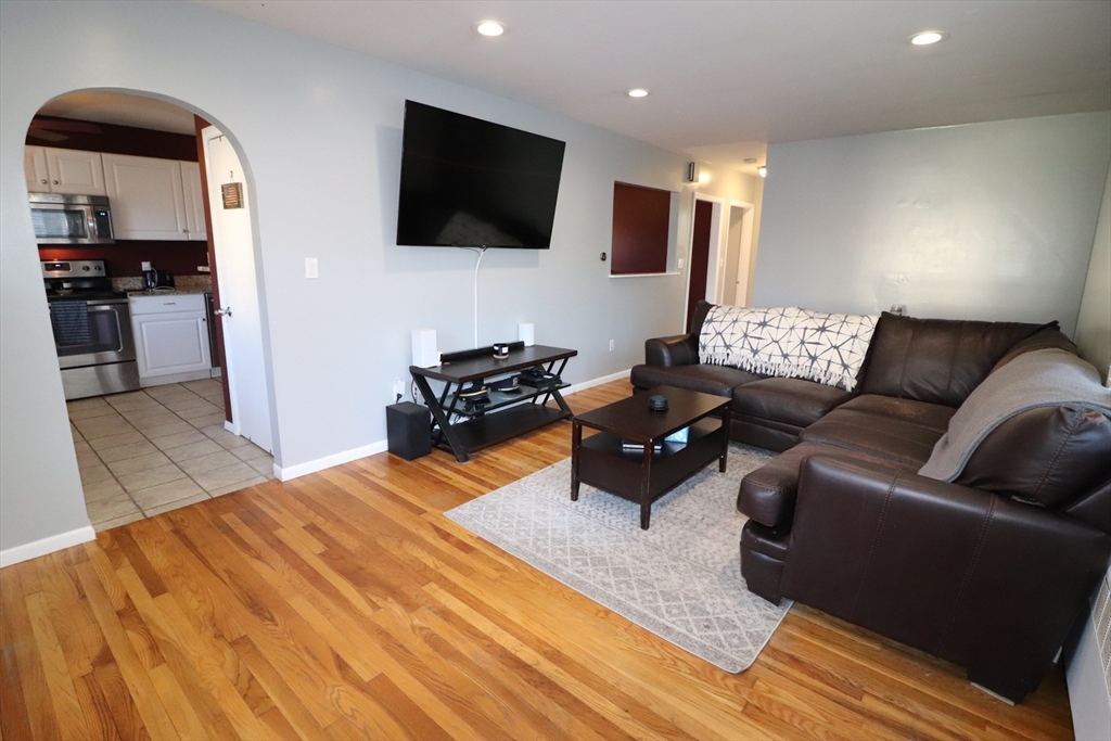 36 Stony Brook Road Raynham, MA 02767 - Photo 15 of 30 a living room with furniture and a flat screen tv