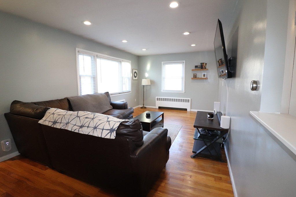 36 Stony Brook Road Raynham, MA 02767 - Photo 16 of 30 a living room with furniture wooden floor and a flat screen tv