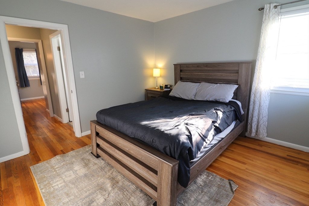 36 Stony Brook Road Raynham, MA 02767 - Photo 19 of 30 a bed sitting in a bedroom next to a window