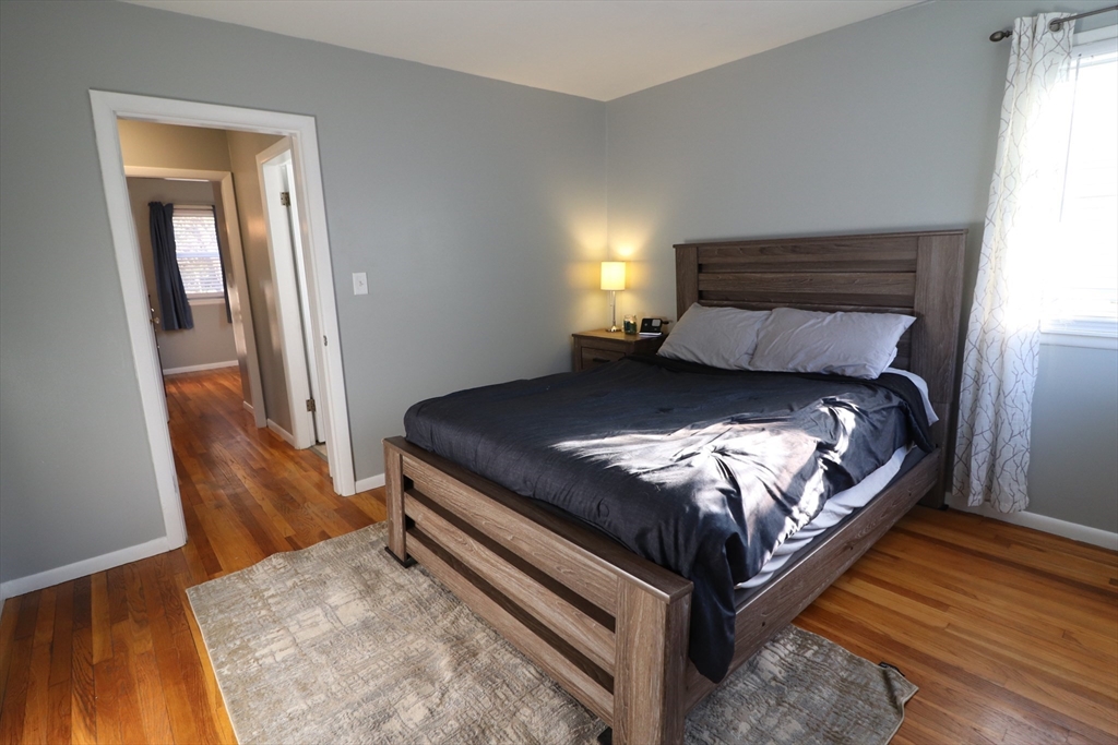 36 Stony Brook Road Raynham, MA 02767 - Photo 20 of 30 a bedroom with a bed and wooden floor