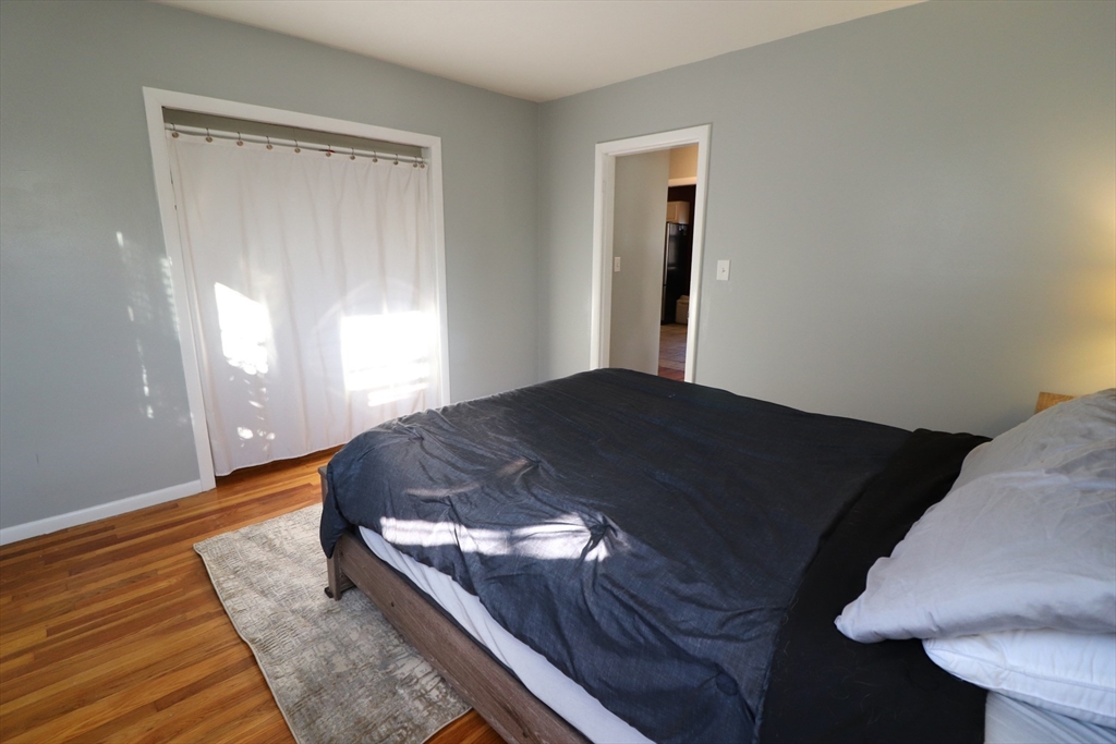 36 Stony Brook Road Raynham, MA 02767 - Photo 21 of 30 a bed sitting in a bedroom next to a window