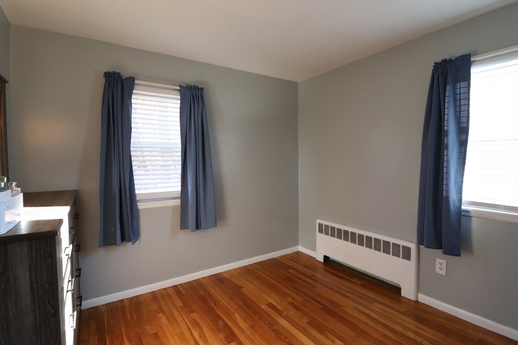 36 Stony Brook Road Raynham, MA 02767 - Photo 23 of 30 a view of an empty room with wooden floor and a window