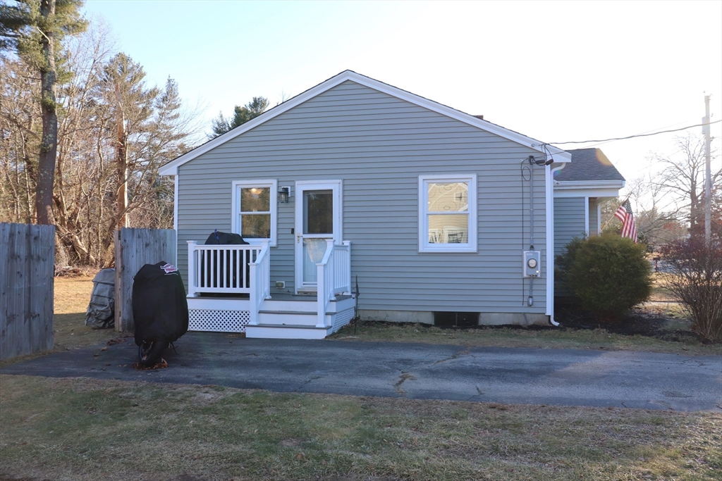 36 Stony Brook Road Raynham, MA 02767 - Photo 4 of 30 a view of a house with a yard and wooden fence