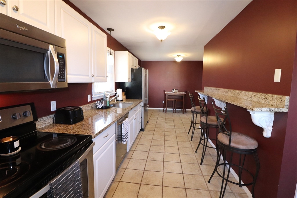36 Stony Brook Road Raynham, MA 02767 - Photo 8 of 30 a kitchen with a sink and cabinets