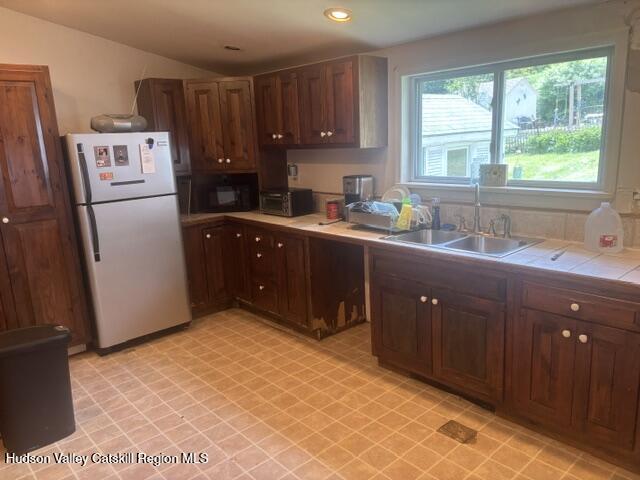 37004 Highway 23 Roxbury, NY 12434 - Photo 8 of 14 a kitchen with stainless steel appliances granite countertop a refrigerator a sink a stove with wooden cabinets