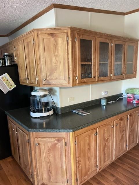 1001 Elizabeth Coleman, TX 76834 - Photo 13 of 32 a kitchen with granite countertop a sink and cabinets