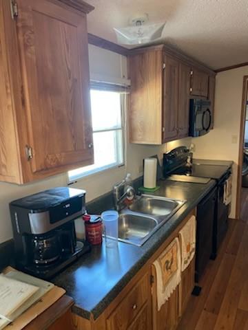 1001 Elizabeth Coleman, TX 76834 - Photo 14 of 32 a kitchen with a sink stove and cabinets