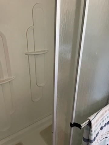 1001 Elizabeth Coleman, TX 76834 - Photo 22 of 32 a bathroom with a glass shower door